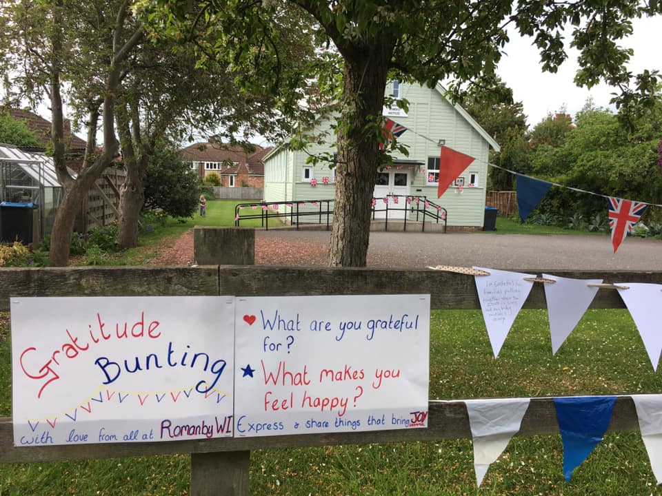 Bunting and poster tied to a fence