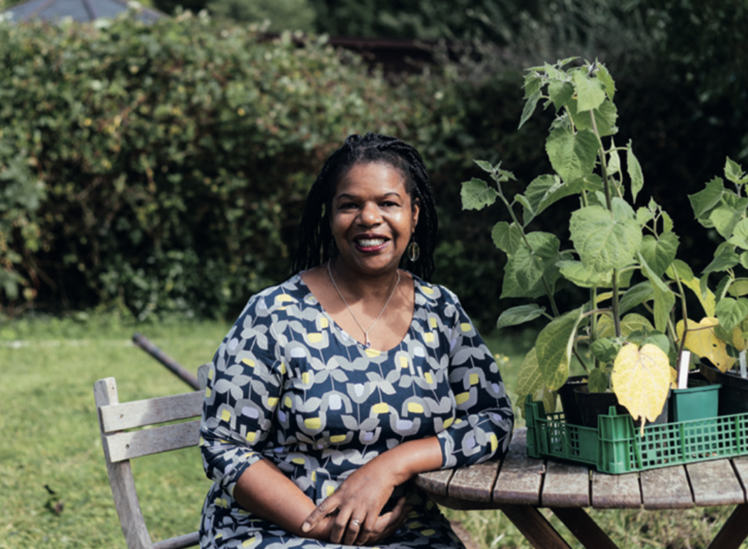 Portrait of Jacquie Felix-Mitchell sitting in a garden