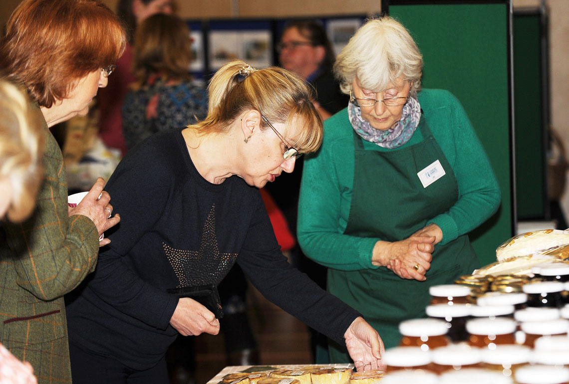 WI members in Wales gathered at a table talking